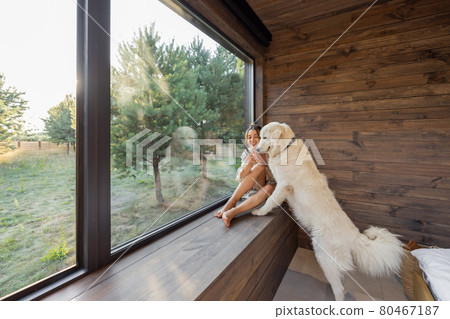 Woman enjoy nature at country house with pet 80467187