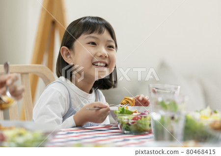 8-year-old girl eating 8-year-old girl eating 80468415