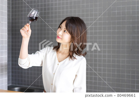 Female sommelier tasting wine 80469661