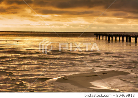 A sand bar with a beautiful ocean sunset in the background. Photo from Hallevik, Blekinge, Sweden 80469918