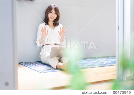 Young woman having a video chat 80470949