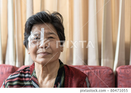 Cataract elderly patient, Asian old senior woman having eye care treatment on Age-related eye diseases, AMD, Diabetic retinopathy, retinal disorders problem, Retinal detachment, Glaucoma or low vision 80471055
