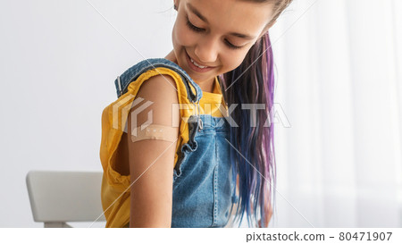 Happy Vaccinated Teen Girl Showing Shoulder After Shot Happy Vaccinated Teen Girl Showing Shoulder After Shot 80471907