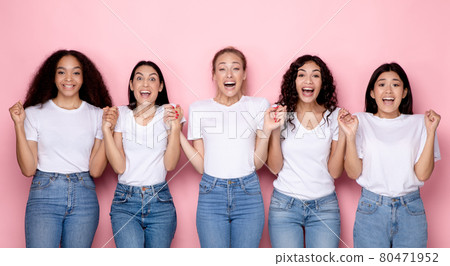 Excited Millennial Women Holding Hands Over Pink Background, Panorama 80471952