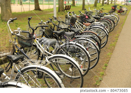 Bicycle are favorite transportation in Japan. Many of bicycle park on the sidewalk. Bicycle are favorite transportation in Japan. Many of bicycle park on the sidewalk. 80473085