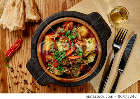 Georgian lamb stew Chanakhi with vegetables in ketsi pan 80473248