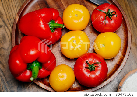 yellow and red tomatoes and bell pepper with water drops. food blogger, stylist 80475162