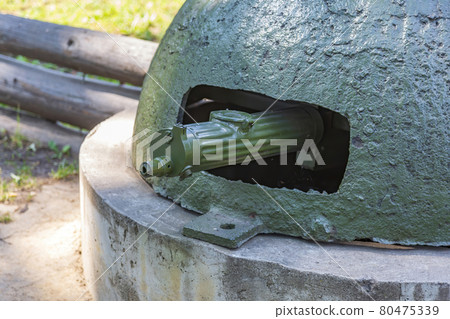 Fortified military firing point with a machine gun from the WWII Fortified military firing point with a machine gun from the WWII 80475339