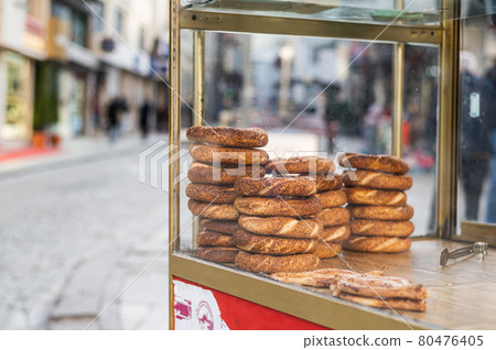 Street wagon in Turkey selling simit, a traditional Turkish street food. Street wagon in Turkey selling simit, a traditional Turkish street food. 80476405