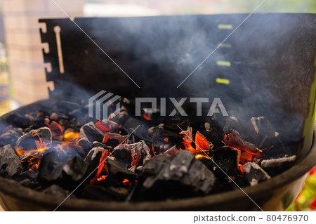 Stock image of charcoal fire grill, close up with live flames. Stock image of charcoal fire grill, close up with live flames. 80476970