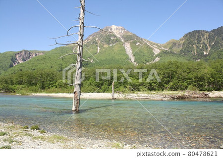 Shinshu Kamikochi, Taisho Pond in Kamikochi surrounded by fresh spring greenery and Mt. Yake in the background Shinshu Kamikochi, Taisho Pond in Kamikochi surrounded by fresh spring greenery and Mt. Yake in the background 80478621