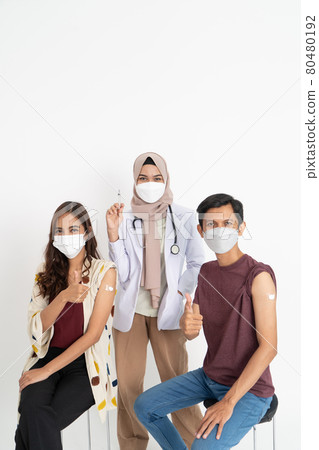 Asian Patient Getting Vaccinated Against Coronavirus by doctor 80480192