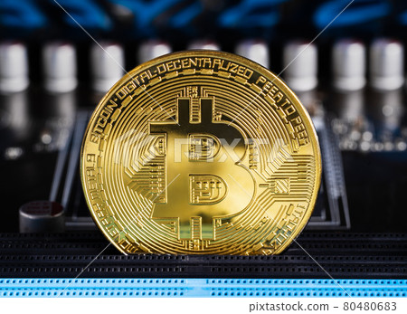 Cryptocurrency bitcoin coins on circuit board 80480683