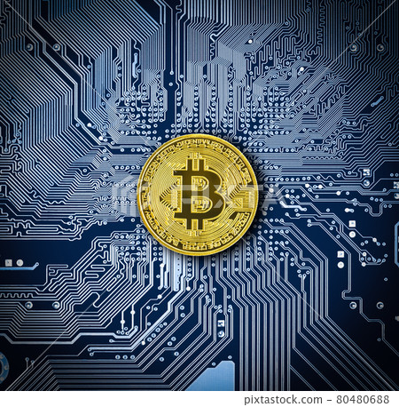 Bitcoin coin on blue circuit board Bitcoin coin on blue circuit board 80480688