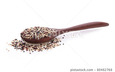 Quinoa seeds in wooden spoon isolated on white background. Quinoa seeds in wooden spoon isolated on white background. 80482768