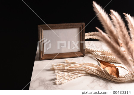 Scenery of a table with a photo frame 80483314