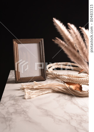 Scenery of a table with a photo frame 80483315