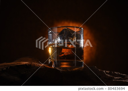 Whiskey glass in the dark Whiskey glass in the dark 80483694