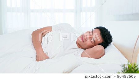 asian man sleep well 80488609