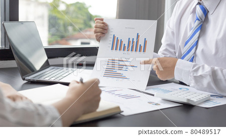 Brainstorm team, Marketers and financial accountants are discussing and analyzing charts to plan strategies to meet customer needs, Business data graph, Team meetings or business consulting. 80489517