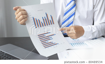 Asian business women are analyzing graphs, Financial statistics and calculating corporate returns in private offices, Market research reports and income statistics, Financial and Accounting concept. 80489534