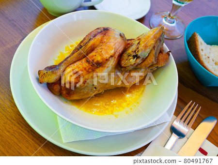 Baked chicken half with sauce. Swiss cuisine Baked chicken half with sauce. Swiss cuisine 80491767