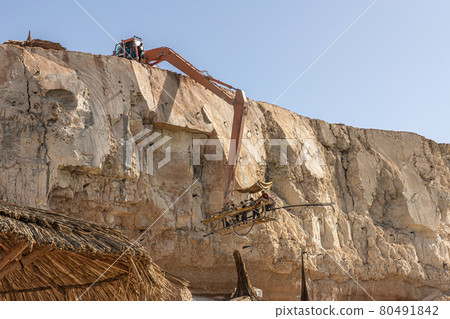 The process of quarrying stone from rocks in Egypt. The process of quarrying stone from rocks in Egypt. 80491842