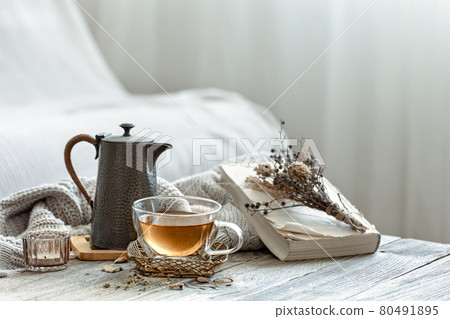 Home still life with a cup of tea and a teapot copy space. 80491895