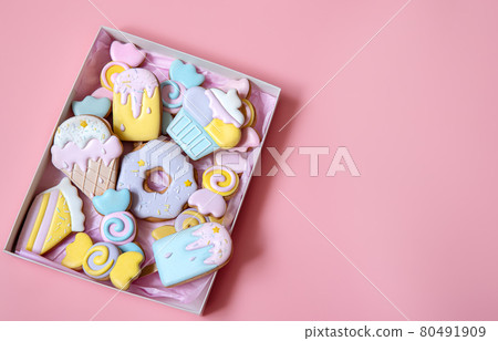 Flat lay box with colorful gingerbread cookies for childrens party. 80491909