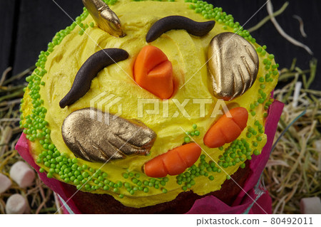 Yellow whipped egg whites in shape of chicken on Easter cake Yellow whipped egg whites in shape of chicken on Easter cake 80492011
