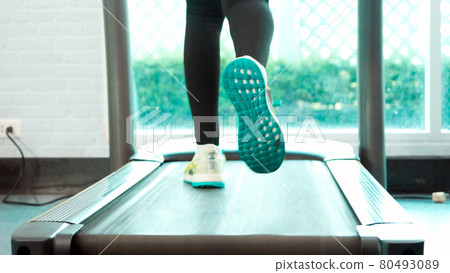 Close up Foot Fitness Asian woman walk warm up and running on treadmill 80493089