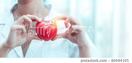 Doctor in white uniform holding medical heart, pulse check cardiology with icon symbol treatment. Doctor in white uniform holding medical heart, pulse check cardiology with icon symbol treatment. 80494105