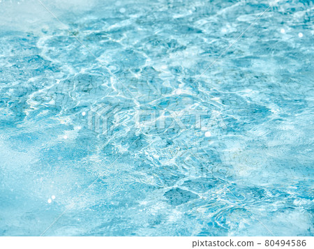Sun beams on surface of water in swimming pool or fountain with blue mosaic bottom. Abstract background with wavy pattern of clear transparent water. Sun beams on surface of water in swimming pool or fountain with blue mosaic bottom. Abstract background with wavy pattern of clear transparent water. 80494586