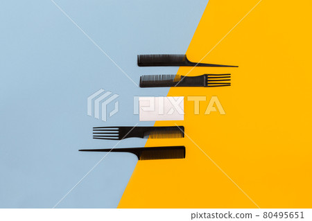 Set of combs on blue and yellow background. Top view Set of combs on blue and yellow background. Top view 80495651
