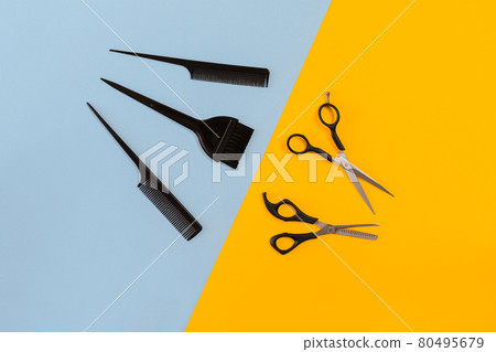 Hairdresser set with various accessories on orange and blue background Hairdresser set with various accessories on orange and blue background 80495679
