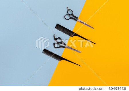 Hairdresser set with various accessories on orange and blue background Hairdresser set with various accessories on orange and blue background 80495686
