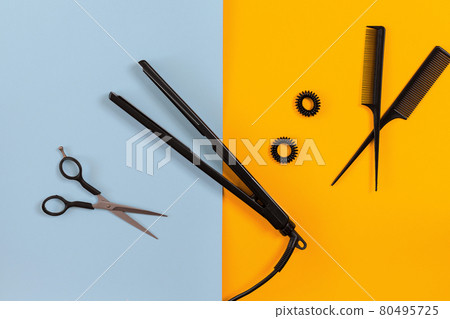 Hairdresser set with various accessories on orange and blue background Hairdresser set with various accessories on orange and blue background 80495725