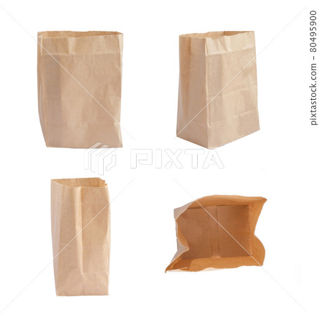 Recyclable brown shopping paper delivery bag isolated on white background. Item or product carrier. Eco friendly packaging. Recyclable brown shopping paper delivery bag isolated on white background. Item or product carrier. Eco friendly packaging. 80495900
