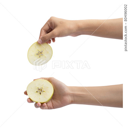 Hand holding an apple. Fresh fruits. Raw organic healthy food. Grocery and supermarket cooking and eating isolated on white background. People Hand holding an apple. Fresh fruits. Raw organic healthy food. Grocery and supermarket cooking and eating isolated on white background. People 80496002