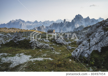 Rifugio Lavaredo with Cadini di Misurina mountain group in background. Dolomites at the Cime di Lavaredo, Italy Rifugio Lavaredo with Cadini di Misurina mountain group in background. Dolomites at the Cime di Lavaredo, Italy 80497454