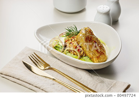 Close-up turkey fillet with garnish and sauce. Baked turkey with bulgur, quinoa and vegetables. Restaurant dish. Cooked poultry with garnish. Light background Table setting with cutlery. Close-up turkey fillet with garnish and sauce. Baked turkey with bulgur, quinoa and vegetables. Restaurant dish. Cooked poultry with garnish. Light background Table setting with cutlery. 80497724