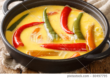 National Dish of Bhutan Ema Datshi closeup in the pan. horizontal 80497795