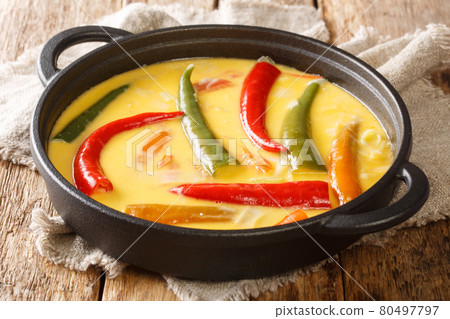 Ema Datshi Bhutanese Chili and Cheese Stew closeup in the pan. horizontal 80497797
