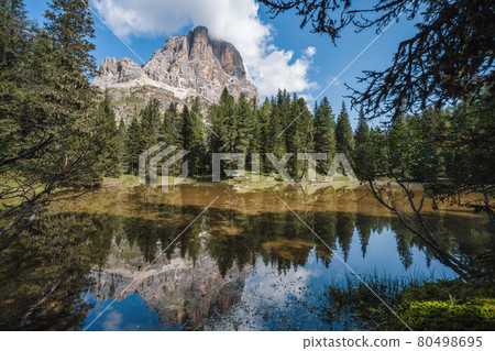 Tofana di Rozes reflected in small pond on Passo Falzarego, Dolomites in the Province of Belluno, Veneto, Italy Tofana di Rozes reflected in small pond on Passo Falzarego, Dolomites in the Province of Belluno, Veneto, Italy 80498695