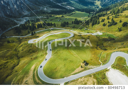 Aerial view of serpentine roud of passo Gardena and Sella group mountains in Dolomites, South Tyrol, Italy, Europe 80498713