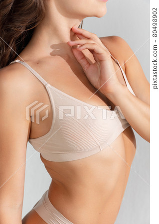 Young beautiful woman in cotton underwear on white background Young beautiful woman in cotton underwear on white background 80498902