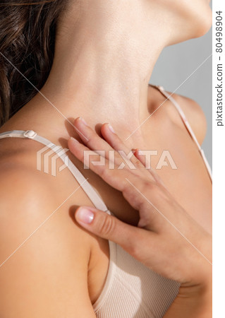 Beautiful woman pampering the neck - on white background. Profile portrait. 80498904