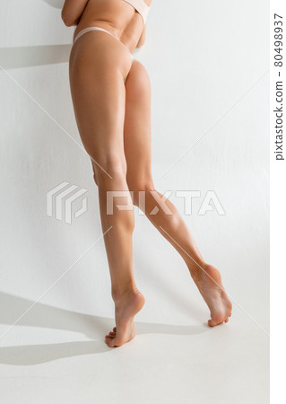 Back view of perfect slim body. Young woman with her natural healthy skin. Back view of perfect slim body. Young woman with her natural healthy skin. 80498937
