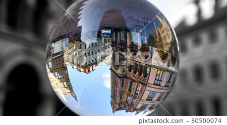 Town houses in the old town of Hanover, Germany, upside down through a glass ball Town houses in the old town of Hanover, Germany, upside down through a glass ball 80500074