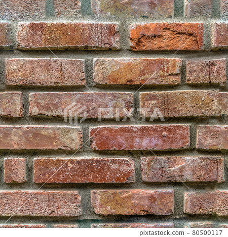 Endless seamless pattern of an old wall of restored bricks with a strongly faded red colour and uneven joints Endless seamless pattern of an old wall of restored bricks with a strongly faded red colour and uneven joints 80500117